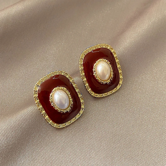 Elegante rot-goldene Perlenohrringe mit Intarsien